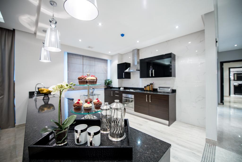 Al Manzil Residence Manáma Szoba fotó